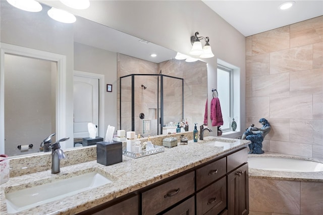 bathroom with shower with separate bathtub and vanity