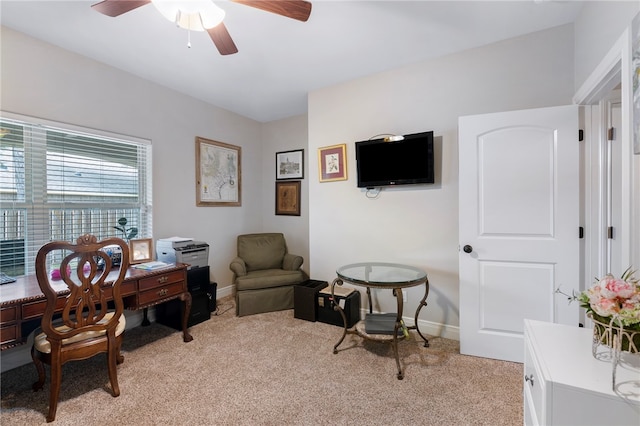 office area featuring ceiling fan and light colored carpet