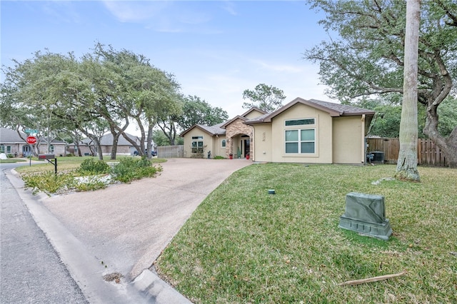 ranch-style house featuring a front yard