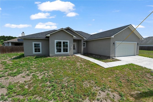 4338 Starlite, Corpus Christi, TX 78410 - ranch-style house with fence, an attached garage, driveway, and stucco siding