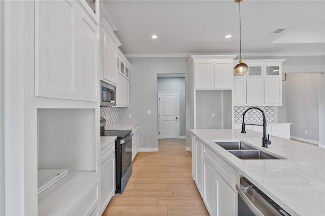 4338 Starlite, Corpus Christi, TX 78410 - kitchen featuring a sink, stainless steel appliances, recessed lighting, tasteful backsplash, and glass insert cabinets