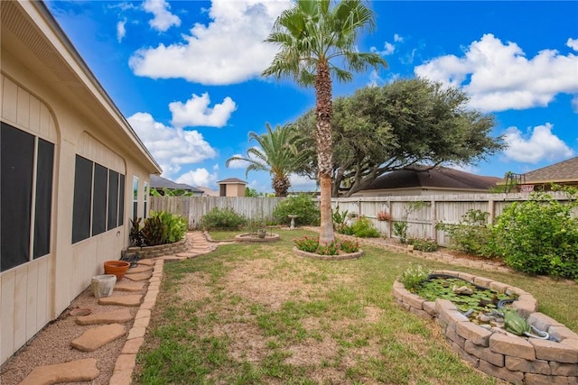 view of yard featuring a fenced backyard