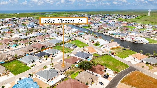 aerial view with a residential view and a water view