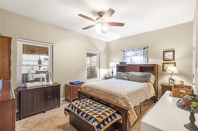 bedroom with a ceiling fan and light tile patterned floors