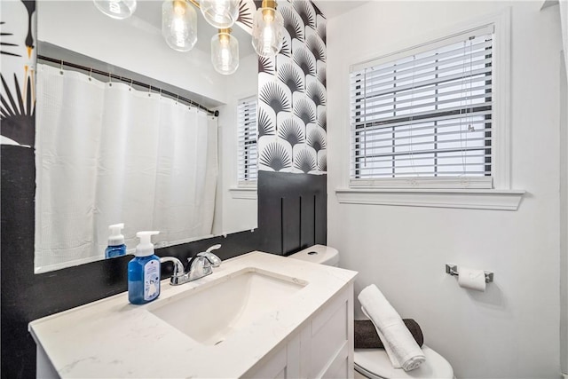 full bathroom with vanity and toilet