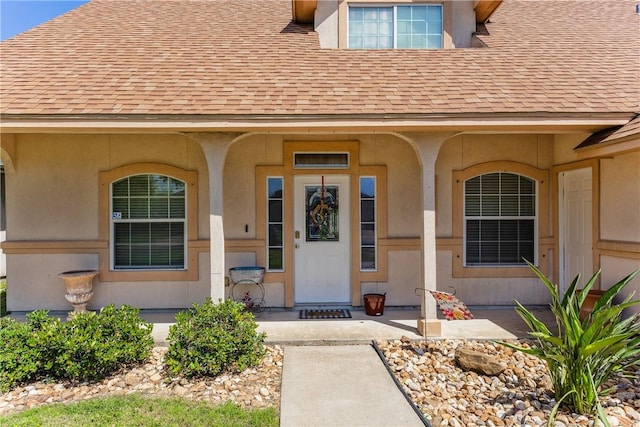 2522 Fleece Dr, Corpus Christi, TX 78414 - property entrance featuring a shingled roof, covered porch, and stucco siding