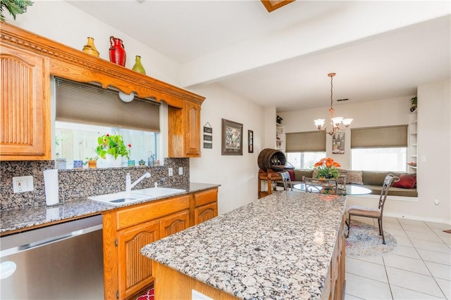 2522 Fleece Dr, Corpus Christi, TX 78414 - kitchen featuring dishwasher, a sink, decorative backsplash, a kitchen island, and open floor plan