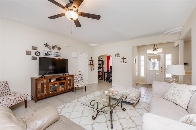 2522 Fleece Dr, Corpus Christi, TX 78414 - living area with arched walkways, ceiling fan, light tile patterned flooring, and baseboards