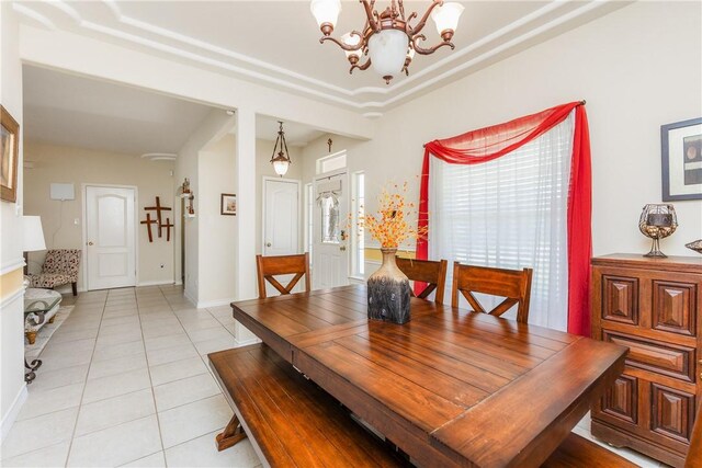2522 Fleece Dr, Corpus Christi, TX 78414 - dining area featuring a chandelier, light tile patterned floors, and baseboards