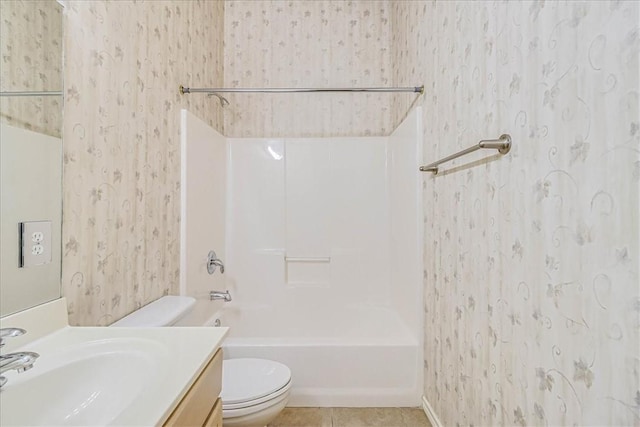 full bathroom featuring wallpapered walls, toilet, vanity, tile patterned flooring, and shower / bathtub combination