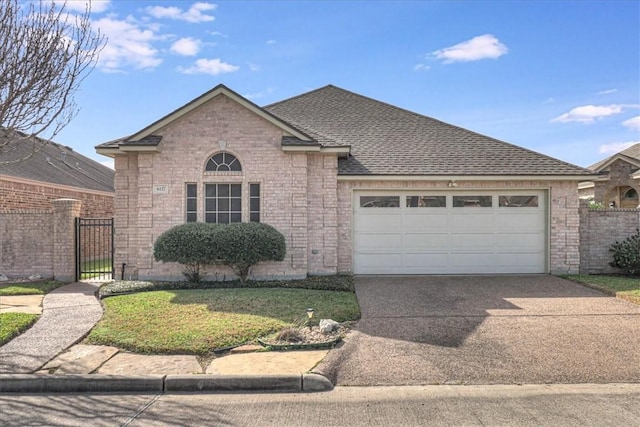 ranch-style house with a garage, a shingled roof, concrete driveway, fence, and brick siding