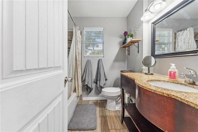 4430 Mistletoe Dr, Corpus Christi, TX 78411 - full bath with vanity, wood finished floors, and shower / tub combo