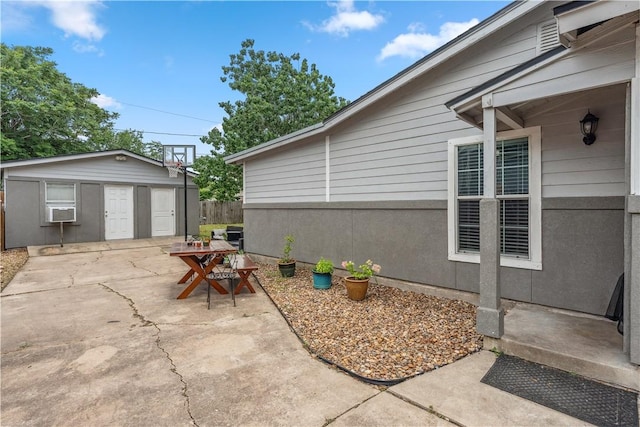 4430 Mistletoe Dr, Corpus Christi, TX 78411 - view of patio / terrace featuring cooling unit and an outbuilding