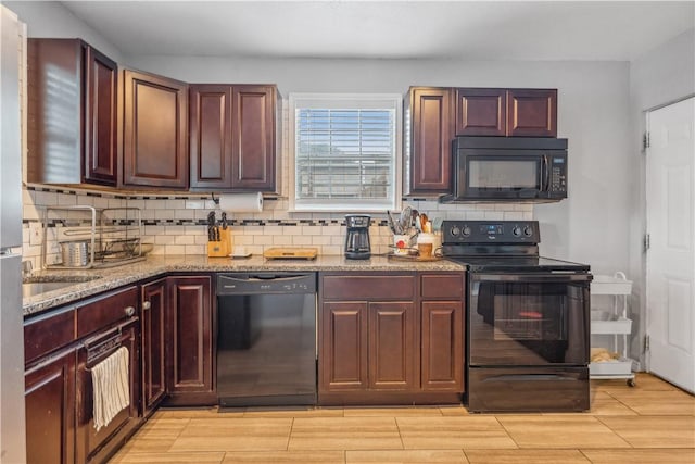 4430 Mistletoe Dr, Corpus Christi, TX 78411 - kitchen with black appliances, decorative backsplash, light stone countertops, wood tiled floors, and dark brown cabinets