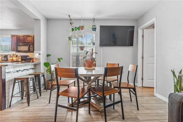4430 Mistletoe Dr, Corpus Christi, TX 78411 - dining space with light wood-type flooring and baseboards