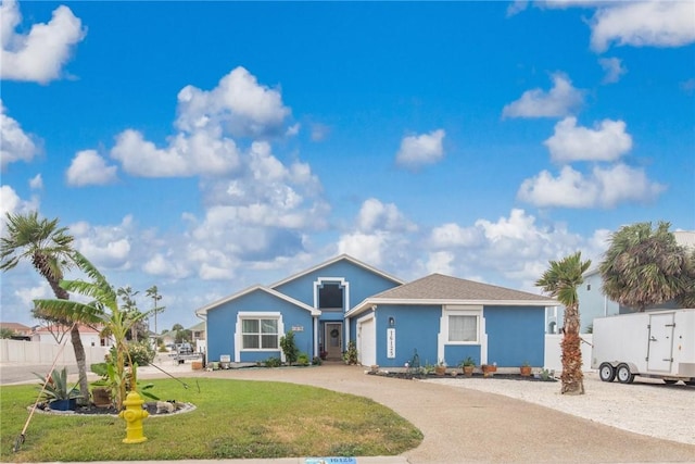 single story home with a front lawn