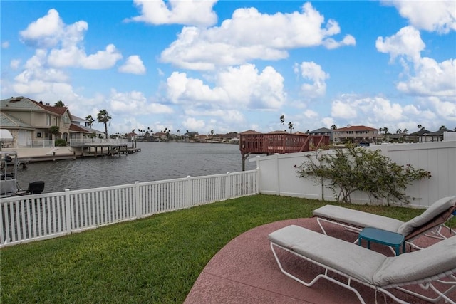 view of yard with a dock and a water view