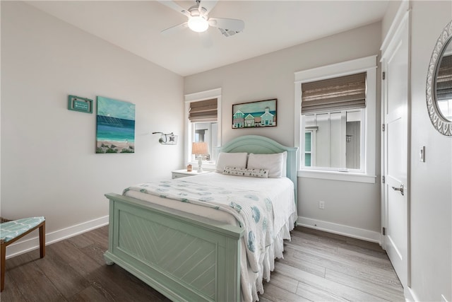 bedroom with wood-type flooring and ceiling fan