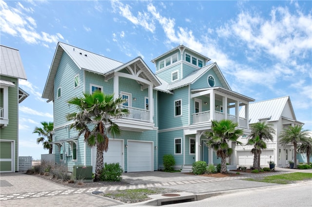 view of front of house with a balcony and a garage