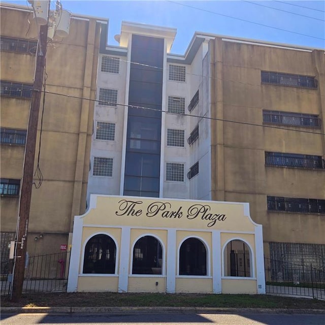 view of building exterior featuring fence