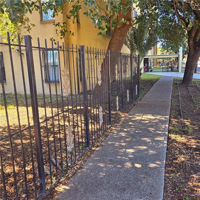 view of gate featuring a fenced front yard