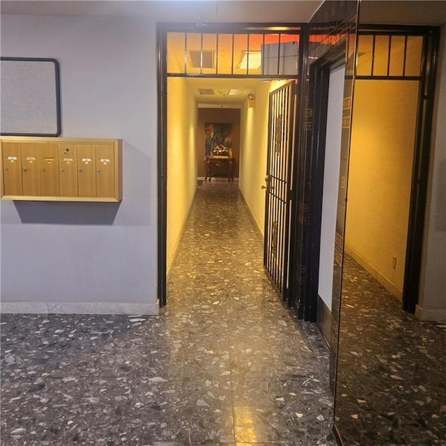 corridor with visible vents and mail area