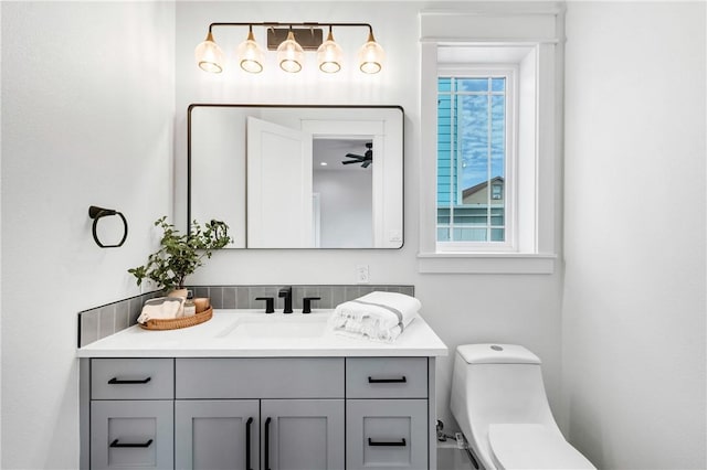 bathroom featuring vanity and toilet