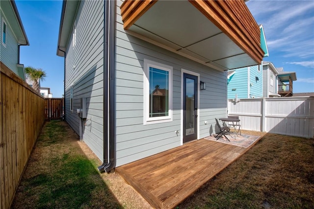 rear view of house featuring a patio area and a lawn