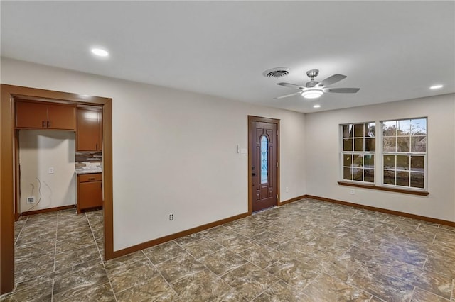 unfurnished room with ceiling fan