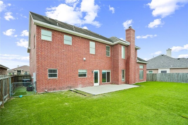 7445 Lake Micala Dr, Corpus Christi, TX 78413 - rear view of property with a chimney, brick siding, a patio area, and a fenced backyard