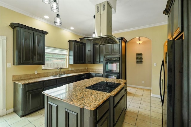 7445 Lake Micala Dr, Corpus Christi, TX 78413 - kitchen with black appliances, island exhaust hood, arched walkways, light tile patterned floors, and ornamental molding