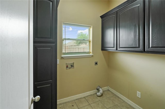 7445 Lake Micala Dr, Corpus Christi, TX 78413 - washroom with hookup for an electric dryer, cabinet space, hookup for a washing machine, and light tile patterned floors