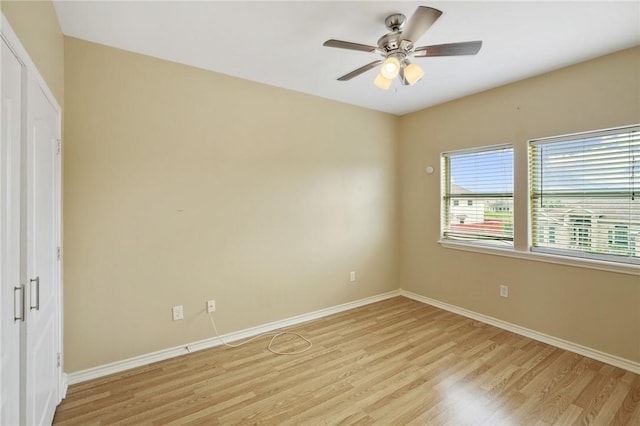 7445 Lake Micala Dr, Corpus Christi, TX 78413 - unfurnished bedroom with light wood-style flooring and ceiling fan