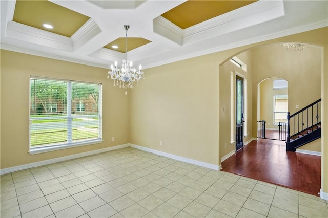 7445 Lake Micala Dr, Corpus Christi, TX 78413 - empty room featuring plenty of natural light, crown molding, arched walkways, light tile patterned flooring, and a chandelier