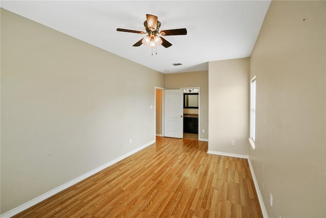 7445 Lake Micala Dr, Corpus Christi, TX 78413 - empty room with light wood finished floors and ceiling fan