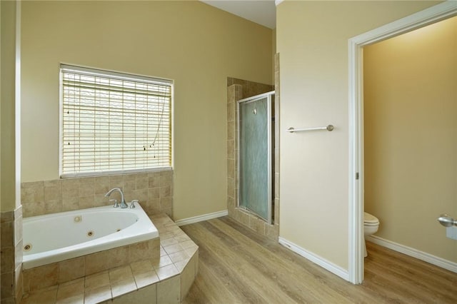 7445 Lake Micala Dr, Corpus Christi, TX 78413 - full bath featuring a tub with jets, a shower stall, and wood finished floors