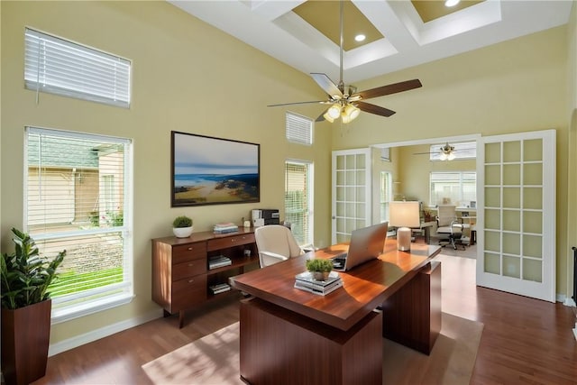 7445 Lake Micala Dr, Corpus Christi, TX 78413 - home office with a towering ceiling, healthy amount of natural light, coffered ceiling, dark wood-style floors, and ceiling fan