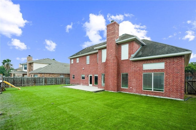 7445 Lake Micala Dr, Corpus Christi, TX 78413 - back of property with a patio, a fenced backyard, a chimney, and brick siding