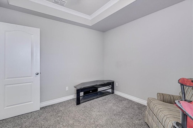 sitting room featuring carpet, baseboards, visible vents, and a tray ceiling