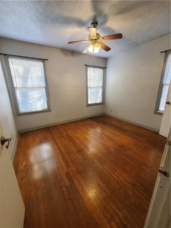1041 Whitaker Dr, Corpus Christi, TX 78412 - empty room featuring wood-type flooring, a textured ceiling, and ceiling fan