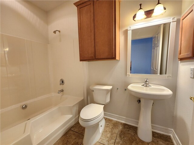 full bathroom featuring washtub / shower combination, toilet, and sink