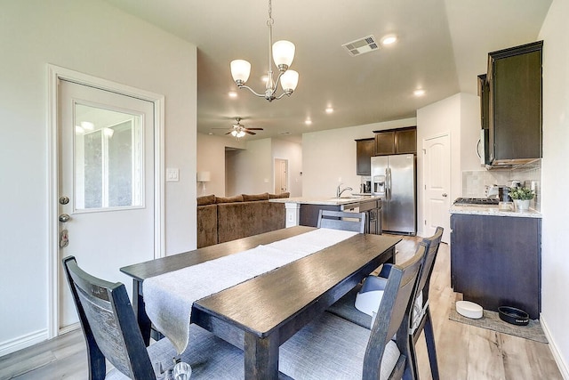 7510 Lasso Dr, Corpus Christi, TX 78414 - dining space featuring light wood-style floors, a chandelier, ceiling fan, recessed lighting, and baseboards