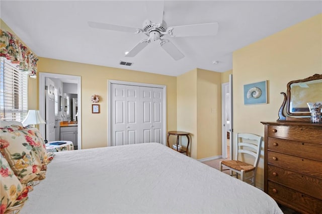 bedroom featuring a closet, baseboards, connected bathroom, ceiling fan, and carpet floors