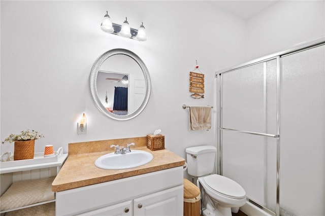 full bath with toilet, a shower stall, and vanity