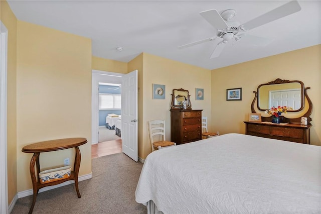 bedroom with carpet, ceiling fan, and baseboards