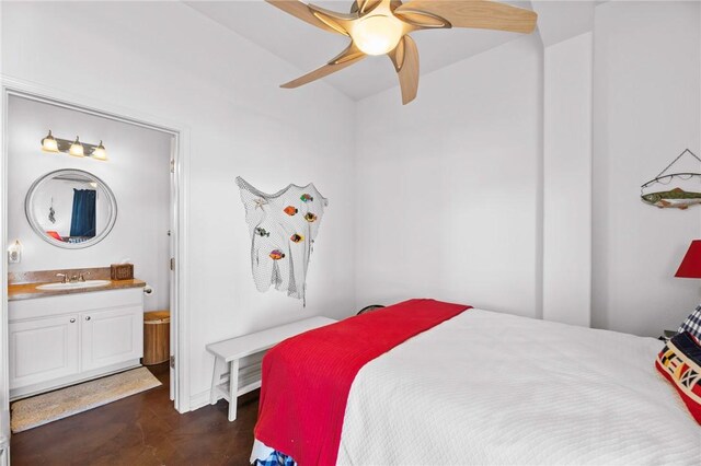 bedroom with a sink, connected bathroom, and concrete floors