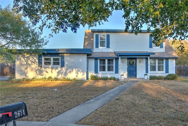 view of property with a front lawn