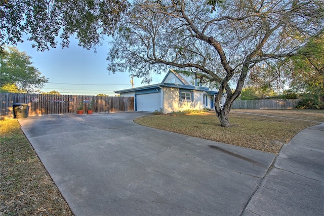 ranch-style house with a front lawn and a garage