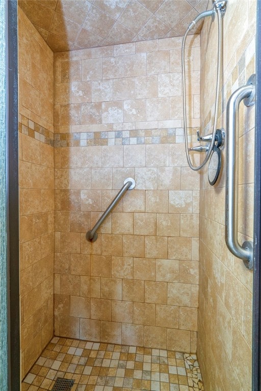 bathroom with a tile shower