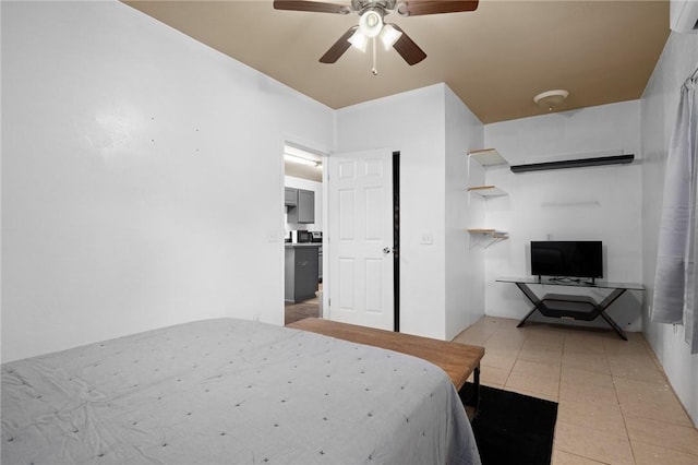 bedroom featuring a ceiling fan and light tile patterned floors